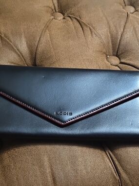 Lodis Black Leather Envelope Clutch with Wine Trim
